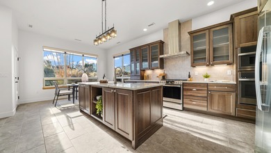 Introducing this beautifully updated ranch style home adjacent on The Golf Club At Redlands Mesa in Colorado - for sale on GolfHomes.com, golf home, golf lot