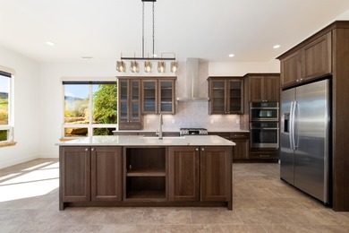 Introducing this beautifully updated ranch style home adjacent on The Golf Club At Redlands Mesa in Colorado - for sale on GolfHomes.com, golf home, golf lot