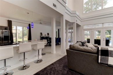 Stunning contemporary architecture frames the wide open interior on Plantation Bay Golf and Country Club in Florida - for sale on GolfHomes.com, golf home, golf lot