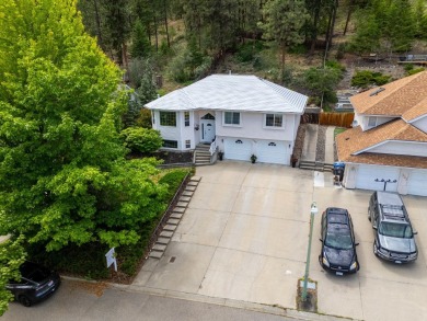 This 4-bed, 3-bath family home is in North Glenmore's heart on  in  - for sale on GolfHomes.com, golf home, golf lot