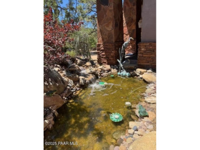 Perched on 1.4 wooded acres is a stunning Sedona red-rock home on Capital Canyon Club in Arizona - for sale on GolfHomes.com, golf home, golf lot
