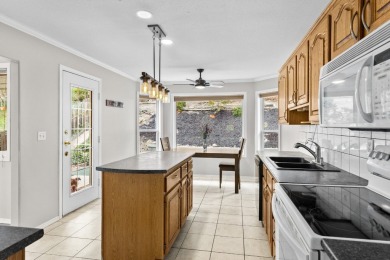 This 4-bed, 3-bath family home is in North Glenmore's heart on  in  - for sale on GolfHomes.com, golf home, golf lot