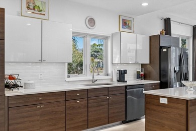 Stunning contemporary architecture frames the wide open interior on Plantation Bay Golf and Country Club in Florida - for sale on GolfHomes.com, golf home, golf lot