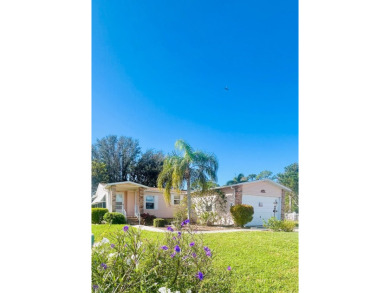Discover Your New Home! This spacious two-bedroom, two-bath home on Pine Lakes Country Club in Florida - for sale on GolfHomes.com, golf home, golf lot