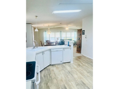 Discover Your New Home! This spacious two-bedroom, two-bath home on Pine Lakes Country Club in Florida - for sale on GolfHomes.com, golf home, golf lot
