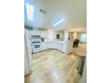 Discover Your New Home! This spacious two-bedroom, two-bath home on Pine Lakes Country Club in Florida - for sale on GolfHomes.com, golf home, golf lot