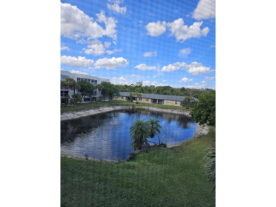 PRICED TO SELL! Enjoy this 2 bedroom lakefront condo with large on Poinciana Golf Club in Florida - for sale on GolfHomes.com, golf home, golf lot