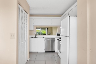 PRICED TO SELL! Enjoy this 2 bedroom lakefront condo with large on Poinciana Golf Club in Florida - for sale on GolfHomes.com, golf home, golf lot