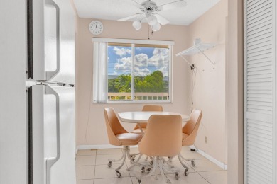 PRICED TO SELL! Enjoy this 2 bedroom lakefront condo with large on Poinciana Golf Club in Florida - for sale on GolfHomes.com, golf home, golf lot