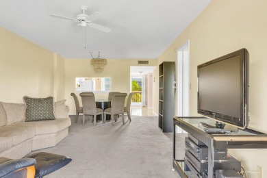 PRICED TO SELL! Enjoy this 2 bedroom lakefront condo with large on Poinciana Golf Club in Florida - for sale on GolfHomes.com, golf home, golf lot