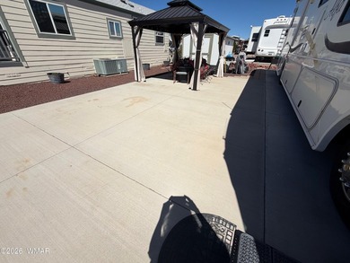 Full concrete slab with full hookups. Nice size shed with on Juniper Ridge R.V. Golf Resort in Arizona - for sale on GolfHomes.com, golf home, golf lot