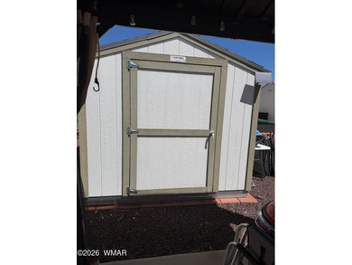 Full concrete slab with full hookups. Nice size shed with on Juniper Ridge R.V. Golf Resort in Arizona - for sale on GolfHomes.com, golf home, golf lot