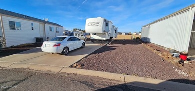 This RV Lot offers a partial view of the golf course fairway and on Juniper Ridge R.V. Golf Resort in Arizona - for sale on GolfHomes.com, golf home, golf lot