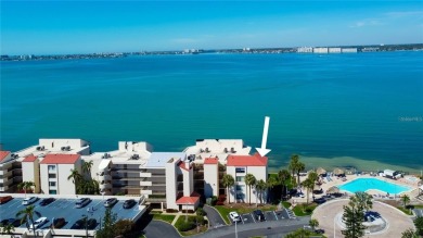 Perched on the top corner of the building, this 2-bedroom on Isla Del Sol Yacht and Country Club in Florida - for sale on GolfHomes.com, golf home, golf lot