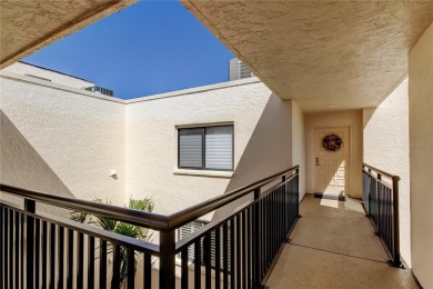 Perched on the top corner of the building, this 2-bedroom on Isla Del Sol Yacht and Country Club in Florida - for sale on GolfHomes.com, golf home, golf lot