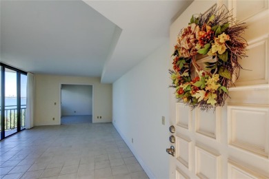 Perched on the top corner of the building, this 2-bedroom on Isla Del Sol Yacht and Country Club in Florida - for sale on GolfHomes.com, golf home, golf lot