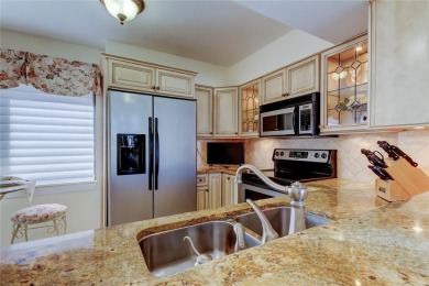 Perched on the top corner of the building, this 2-bedroom on Isla Del Sol Yacht and Country Club in Florida - for sale on GolfHomes.com, golf home, golf lot