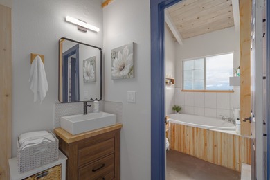 Discover the perfect blend of modern upgrades and island living on Discovery Harbour Golf Course in Hawaii - for sale on GolfHomes.com, golf home, golf lot