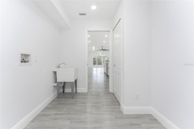 Welcome to this stunning, FULLY REMODELED home located in the on Rotonda Golf and Country Club - Long Marsh  in Florida - for sale on GolfHomes.com, golf home, golf lot