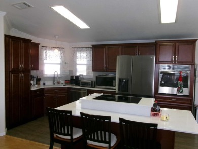 This lakefront beauty is loving maintained and super clean. With on Tomoka Oaks Golf and Country Club in Florida - for sale on GolfHomes.com, golf home, golf lot