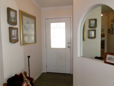This lakefront beauty is loving maintained and super clean. With on Tomoka Oaks Golf and Country Club in Florida - for sale on GolfHomes.com, golf home, golf lot