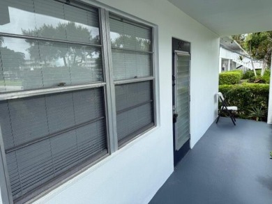 Very desirable 1st floor corner unit with newer kitchen (shaker on Hillsboro Pines Golf in Florida - for sale on GolfHomes.com, golf home, golf lot