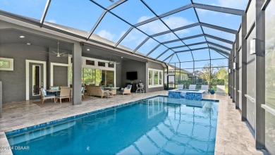 Experience luxury and functionality in this stunning 4-bedroom on Plantation Bay Golf and Country Club in Florida - for sale on GolfHomes.com, golf home, golf lot