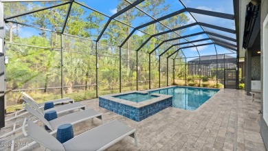 Experience luxury and functionality in this stunning 4-bedroom on Plantation Bay Golf and Country Club in Florida - for sale on GolfHomes.com, golf home, golf lot