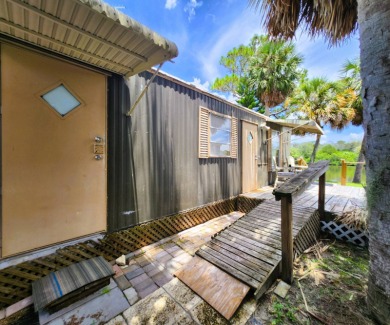 This WATERFRONT home is deemed 100% HABITABLE & ready for on Gulf Harbors Golf Course in Florida - for sale on GolfHomes.com, golf home, golf lot