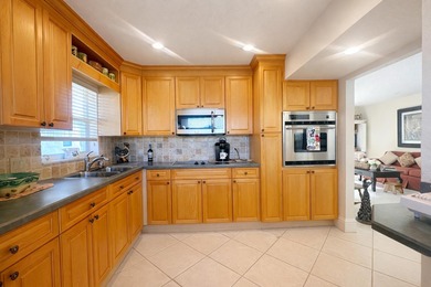 This exceptional two-bedroom, two-bath residence offers refined on The Little Club in Florida - for sale on GolfHomes.com, golf home, golf lot