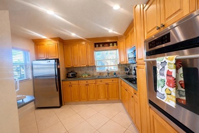 This exceptional two-bedroom, two-bath residence offers refined on The Little Club in Florida - for sale on GolfHomes.com, golf home, golf lot