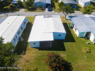 Welcome to your dream home in serene Barefoot Bay, FL! This on Barefoot Bay Golf Course in Florida - for sale on GolfHomes.com, golf home, golf lot