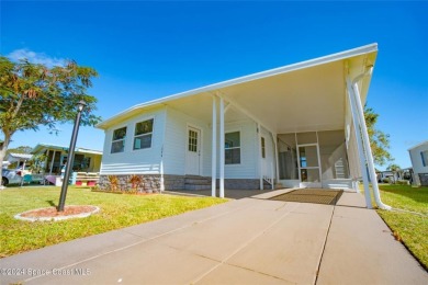 Welcome to your dream home in serene Barefoot Bay, FL! This on Barefoot Bay Golf Course in Florida - for sale on GolfHomes.com, golf home, golf lot