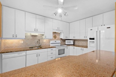 Discover the charm of the Huntingwood neighborhood, nestled in on The Meadows Golf and Country Club in Florida - for sale on GolfHomes.com, golf home, golf lot