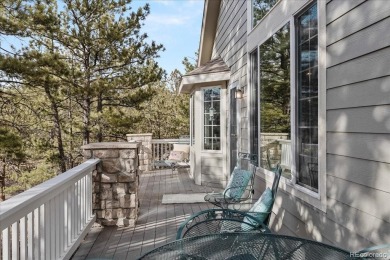 Exquisitely located on the edge of 11 acres of HOA owned forest on The Ridge At Castle Pines North in Colorado - for sale on GolfHomes.com, golf home, golf lot