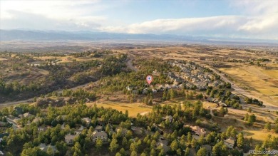 Exquisitely located on the edge of 11 acres of HOA owned forest on The Ridge At Castle Pines North in Colorado - for sale on GolfHomes.com, golf home, golf lot