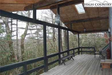 Nestled in the rhododendrons, you'll find this 2bdr/2bath on Land Harbor Golf Course in North Carolina - for sale on GolfHomes.com, golf home, golf lot