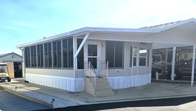 Welcome to 290 Doubles Lane, located in the 55+ Coop Regal Ridge on Deer Creek RV Golf Resort in Florida - for sale on GolfHomes.com, golf home, golf lot