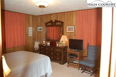 Nestled in the rhododendrons, you'll find this 2bdr/2bath on Land Harbor Golf Course in North Carolina - for sale on GolfHomes.com, golf home, golf lot