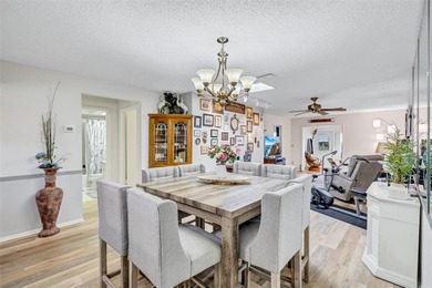 This end unit villa is right next to the covered carport and on Highland Lakes Executive Golf Course in Florida - for sale on GolfHomes.com, golf home, golf lot