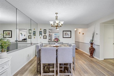 This end unit villa is right next to the covered carport and on Highland Lakes Executive Golf Course in Florida - for sale on GolfHomes.com, golf home, golf lot