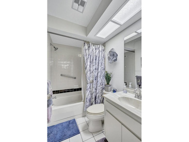 This end unit villa is right next to the covered carport and on Highland Lakes Executive Golf Course in Florida - for sale on GolfHomes.com, golf home, golf lot