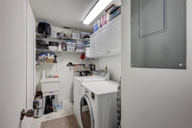 This end unit villa is right next to the covered carport and on Highland Lakes Executive Golf Course in Florida - for sale on GolfHomes.com, golf home, golf lot