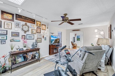 This end unit villa is right next to the covered carport and on Highland Lakes Executive Golf Course in Florida - for sale on GolfHomes.com, golf home, golf lot