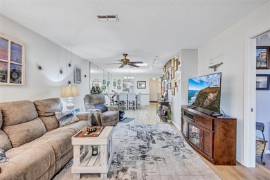 This end unit villa is right next to the covered carport and on Highland Lakes Executive Golf Course in Florida - for sale on GolfHomes.com, golf home, golf lot