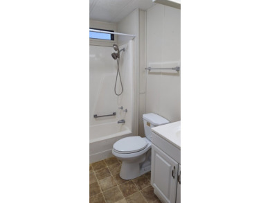 CHARMING COTTAGE HOME WITH PRIVATE BACK YARD! NEW VINYL PLANK on Vista Plantation Golf Club in Florida - for sale on GolfHomes.com, golf home, golf lot