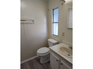 CHARMING COTTAGE HOME WITH PRIVATE BACK YARD! NEW VINYL PLANK on Vista Plantation Golf Club in Florida - for sale on GolfHomes.com, golf home, golf lot