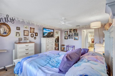 This end unit villa is right next to the covered carport and on Highland Lakes Executive Golf Course in Florida - for sale on GolfHomes.com, golf home, golf lot