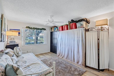 This end unit villa is right next to the covered carport and on Highland Lakes Executive Golf Course in Florida - for sale on GolfHomes.com, golf home, golf lot