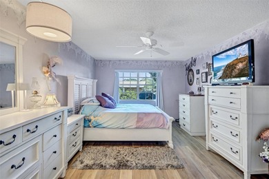 This end unit villa is right next to the covered carport and on Highland Lakes Executive Golf Course in Florida - for sale on GolfHomes.com, golf home, golf lot